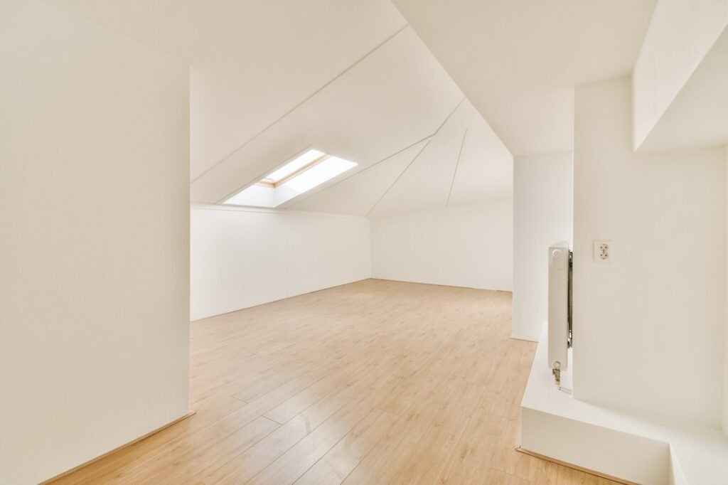 Spacious empty room with parquet floors